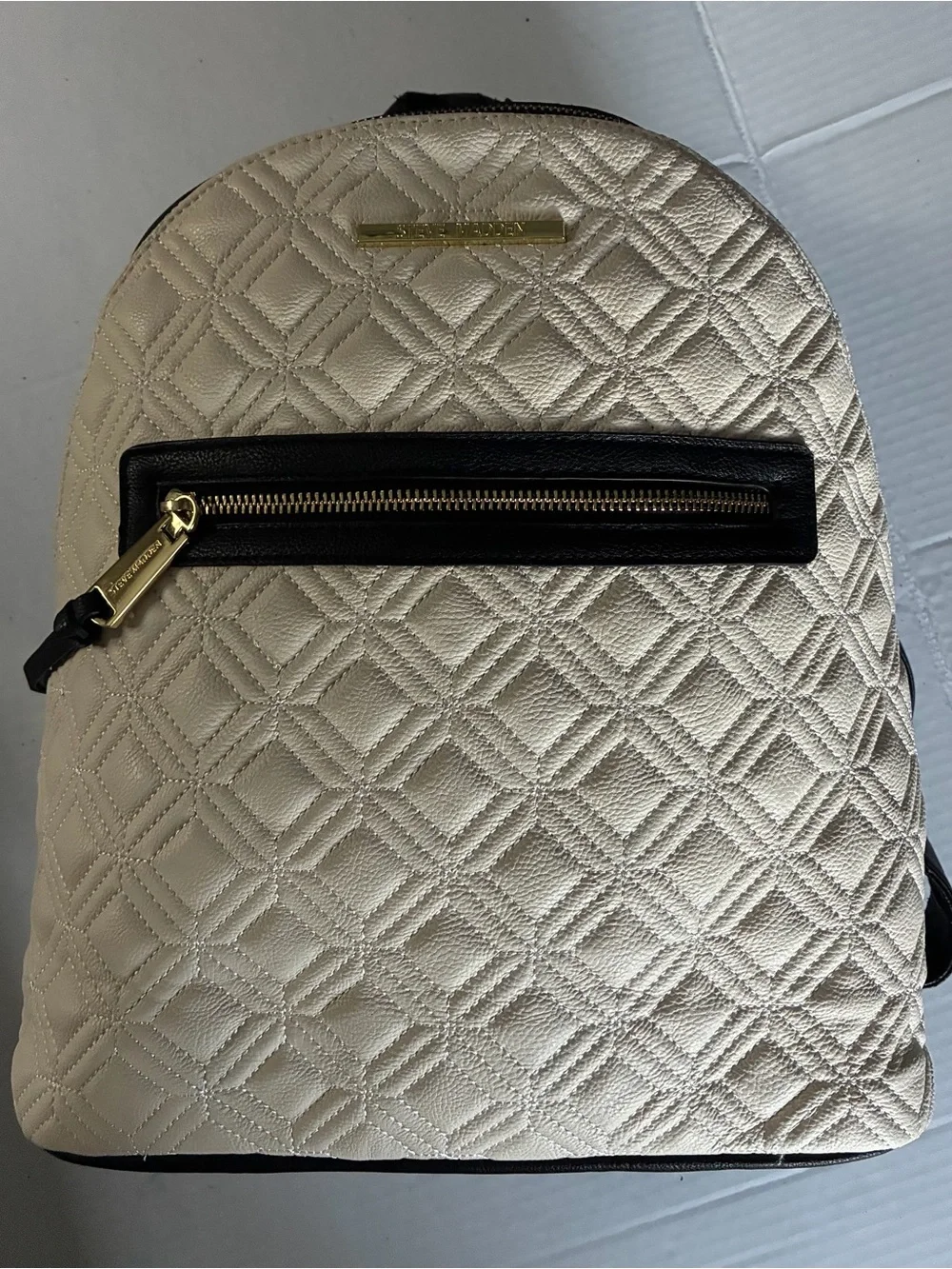Steve Madden Quilted Cream Backpack with Black Trim and Gold Hardware